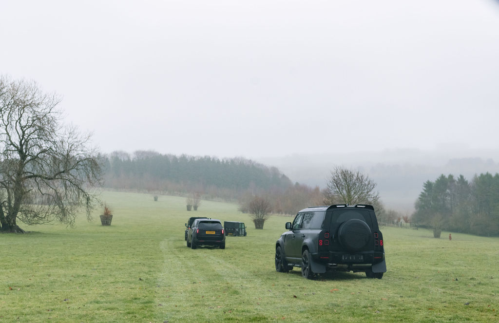 4 x 4s driving across Cotswolds shooting estate