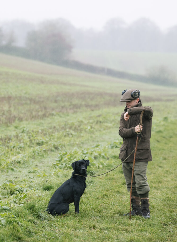 Roxtons shooting consultant Max Cope and his dog Norma on a misty day at Salperton Park shoot