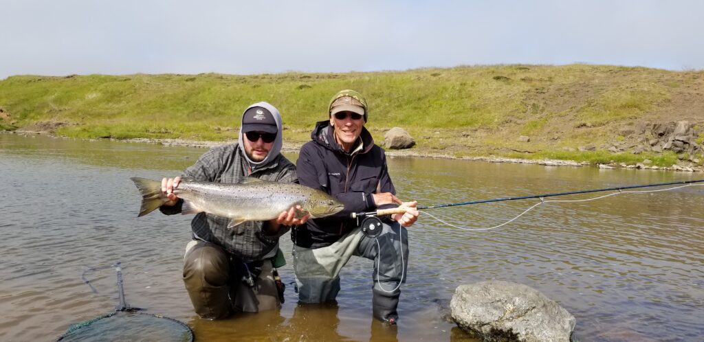 Roxtons Fishing client holding salmon caught in the Midfjardara river in Iceland